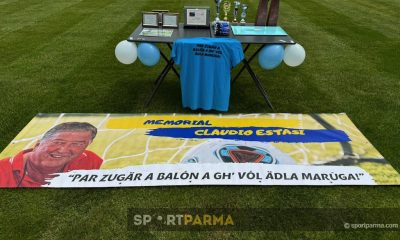 3° memorial Claudio Estasi a Marzolara sabato 8 giugno 2024 il tavolo con i premi e il cartellone con il motto di Claudio Estasi
